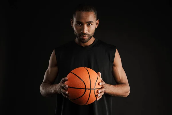 Young Sportsman Looking Camera While Posing Basketball Isolated Black Background — Stock Photo, Image