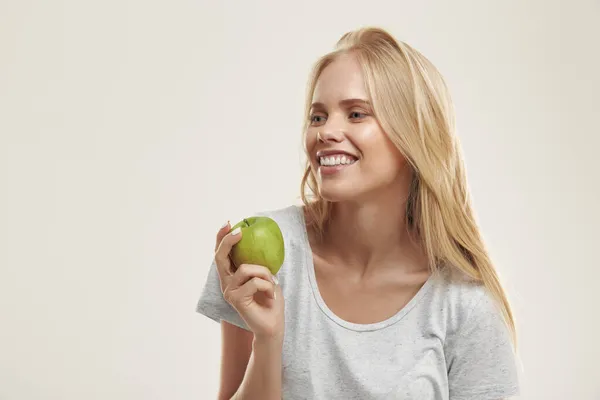 Young Pleased European Girl Holding Green Apple Beautiful Blonde Female — Stock Photo, Image