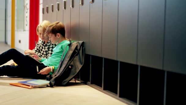 Two Positive Boys Watching Something Tablet While Sitting Floor — Stock Video