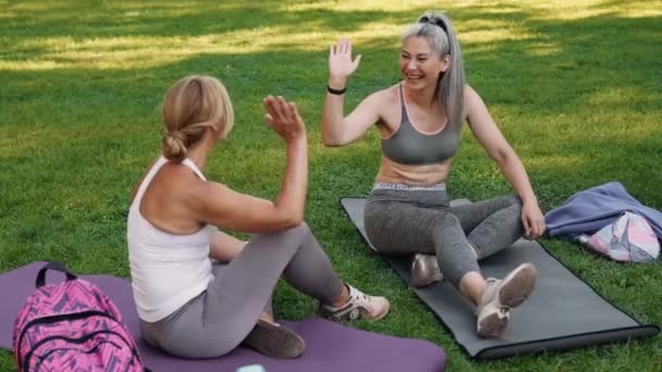 Multinational Laughing Mature Women Giving Five Each Other Yoga Mat — Stock Video