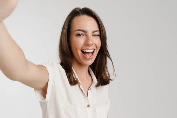 Young European Woman Winking While Taking Selfie Photo Isolated White — Stock Photo, Image