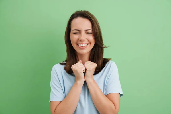 Young European Woman Laughing Clenched Fists Isolated Green Background — Stock Photo, Image