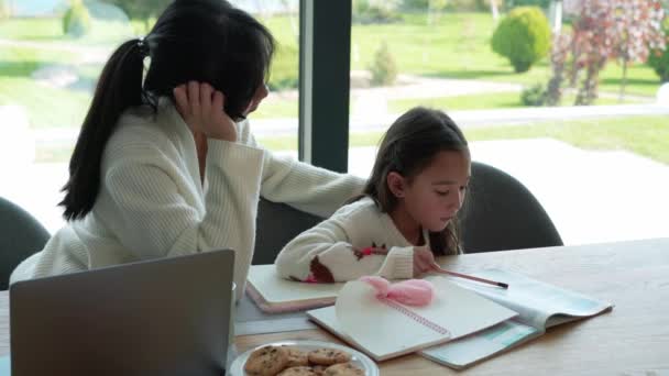 Handsome Asian Mother Helps Her Daughter Doing Homework — Stock Video