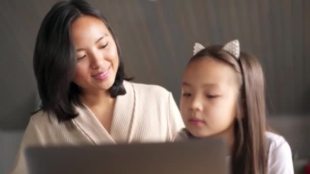 Positive Asian Mom Daughter Looking Laptop Kitchen — Stock Video