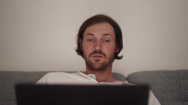 Confident Long Haired Man Working Laptop While Sitting Sofa Home — Stock Video