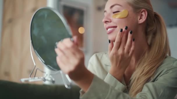 Positive Blond Woman Sticking Patches Eyes Home — Stock Video