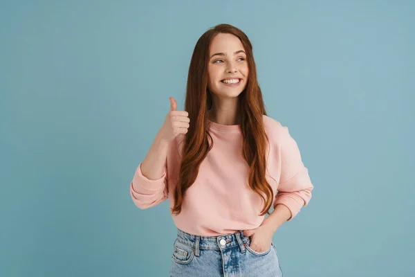 Young Ginger Woman Smiling Showing Thumb Camera Isolated Blue Background — 图库照片