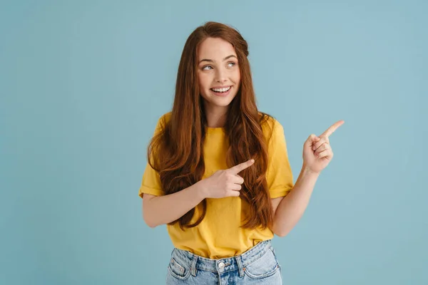 Young Ginger Woman Smiling Pointing Fingers Aside Isolated Blue Background — 图库照片