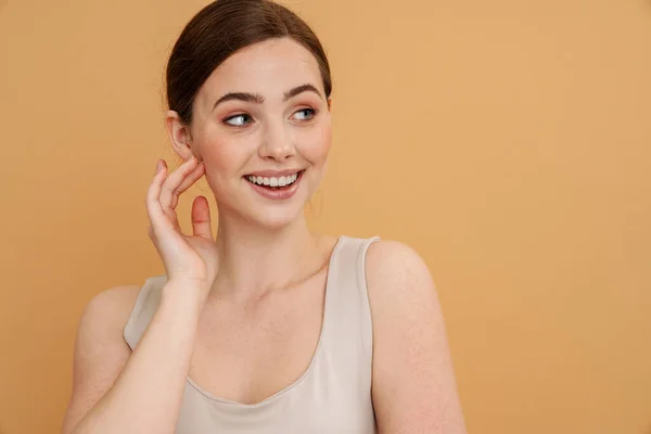 Young Ginger Woman Undershirt Smiling Looking Aside Isolated Yellow Background — Stock Photo, Image