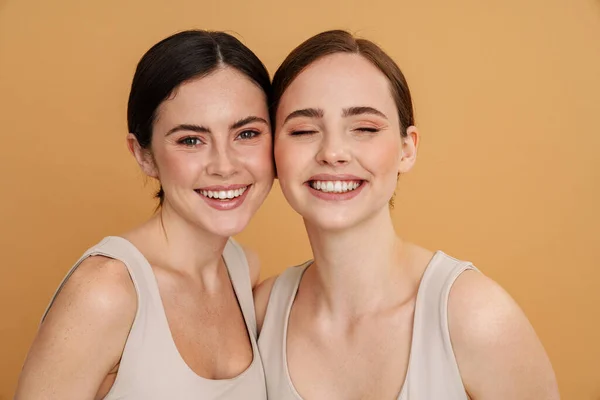 Young Two Women Undershirt Looking Smiling Camera Isolated Yellow Background — Stock Photo, Image