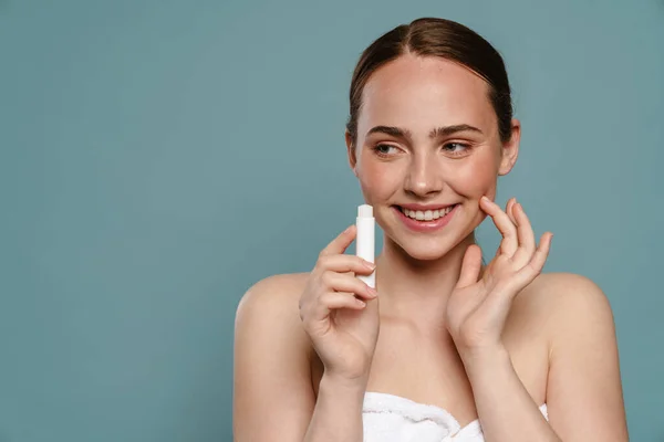 Young Smiling Brown Haired Woman Showing Lip Balm Stick Standing — Stock Photo, Image