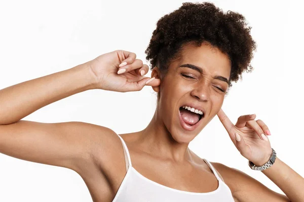 Young Black Woman Tank Top Screaming Plugging Her Ears Isolated — 图库照片
