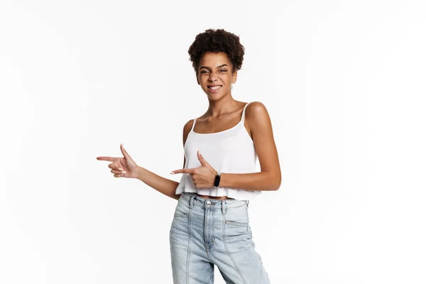 Young Black Woman Tank Top Smiling Pointing Finger Aside Isolated — Stock fotografie