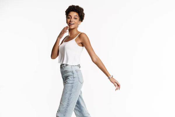 Young Black Woman Tank Top Smiling While Walking Isolated White — Stockfoto