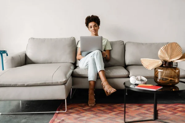 Young Black Woman Working Laptop While Sitting Couch Home — Stock Fotó