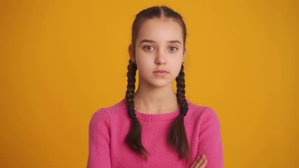 Pensive Girl Pigtails Shaking Her Head Positively Yellow Studio — Stock video