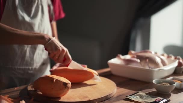 Woman Cuts Sweet Potato Plank Kitchen — Stockvideo