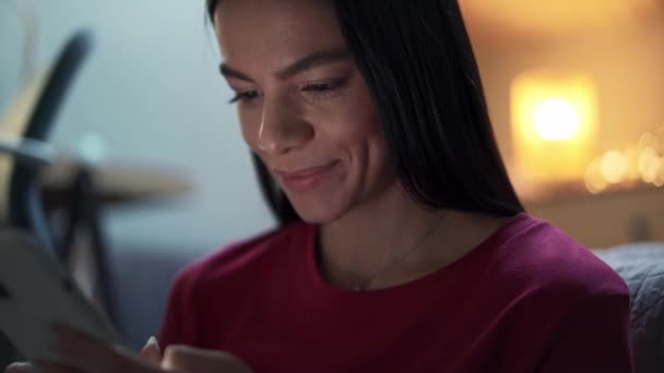 Cheerful Woman Texting Phone Home — Stock video