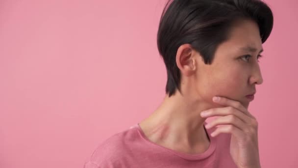 Serious Asian Man Thinking Something Pink Studio — Vídeo de Stock
