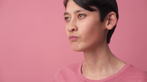 Stylish Asian Man Putting Eyeglasses Pink Studio — Stock videók