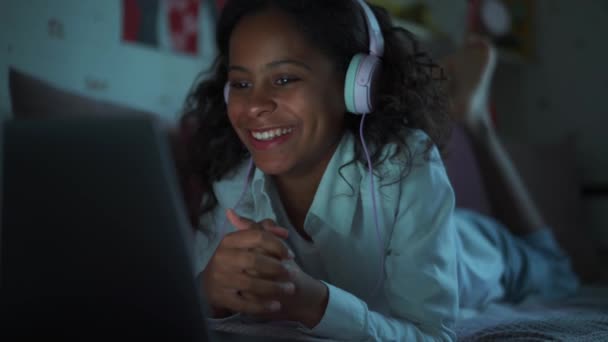 Laughing African Young Girl Headphones Watching Something Laptop Home — Stock Video