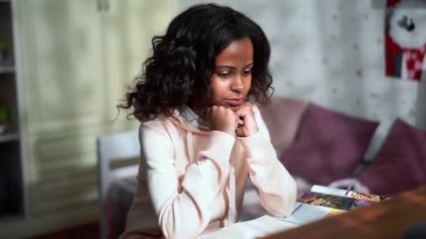 Happy African Young Girl Doing Homework Home — Vídeos de Stock