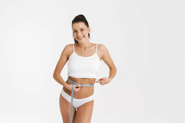 European Woman Wearing Underwear Smiling Measuring Her Waist Isolated White — Stockfoto