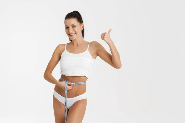 European Woman Wearing Underwear Gesturing Measuring Her Waist Isolated White — Stock Fotó