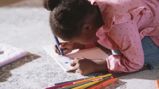 Little African Girl Drawing Something Floor Home — Stock Video