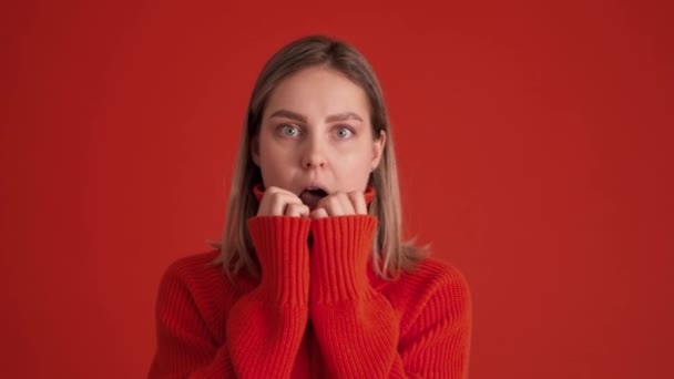 Shocked Woman Wearing Red Sweater Covering Her Face Hands Red — Stock Video