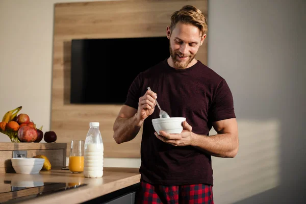 Attractive Healthy Young Man Having Tasty Breakfast While Standing Kitchen — Stock Photo, Image