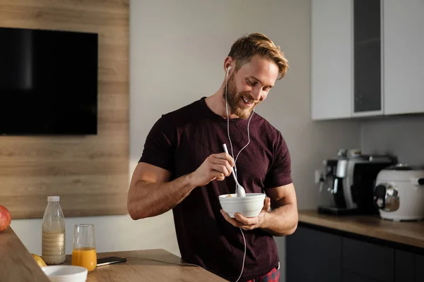 Attractive Healthy Young Man Having Tasty Breakfast While Standing Kitchen — Stock Photo, Image