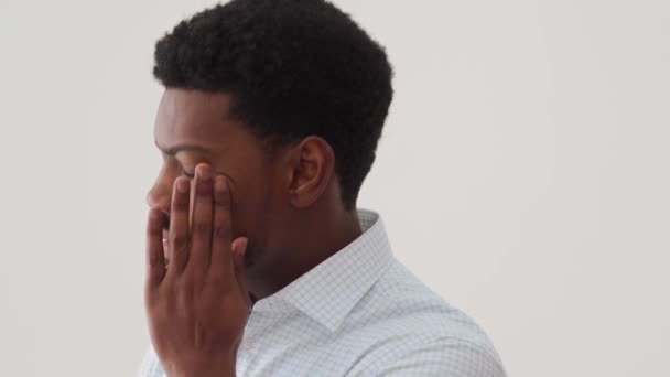 Serious African Man Thinking Something Kneading Temples White Studio — Stock Video