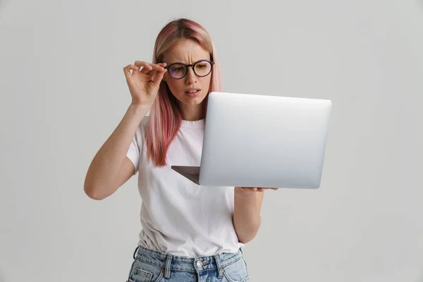 Frowning Upset Young Blonde White Woman Glasses Standing Holding Laptop — Stock Photo, Image