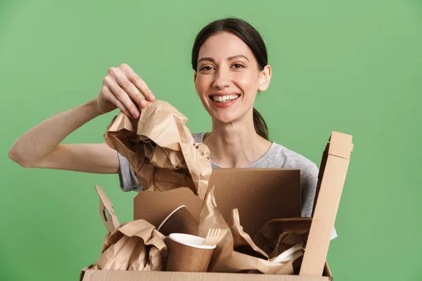 Young Brunette Woman Smiling While Posing Paper Waste Isolated Green — Stock Photo, Image