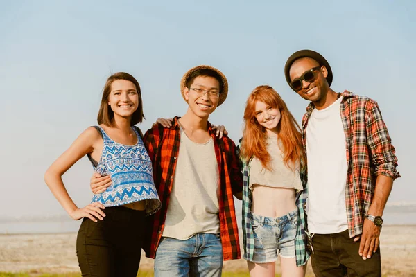 Young Multiracial Friends Hugging Smiling Together While Posing Outdoors — Stock Photo, Image