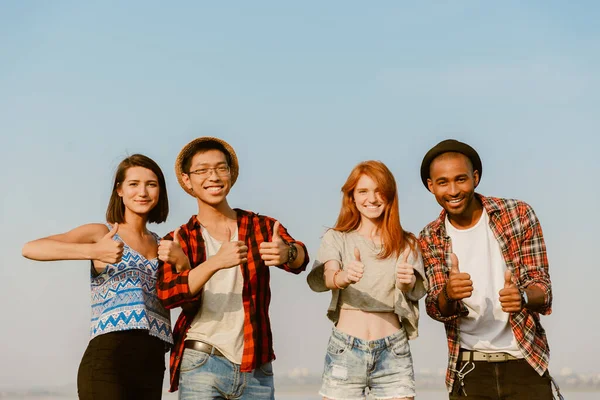 Young Multiracial Friends Showing Thumbs Smiling Outdoors — Stock Photo, Image