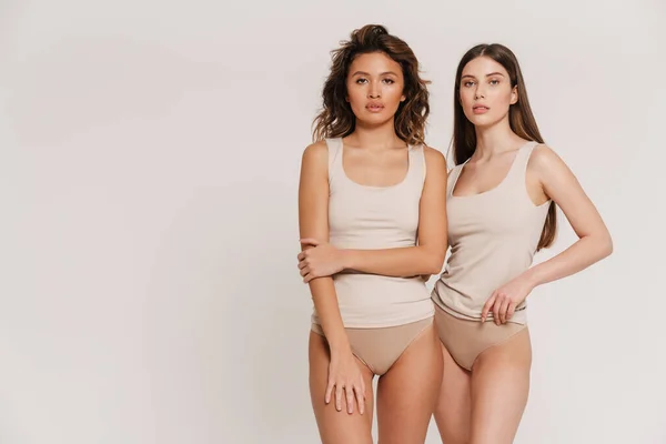 Two Young Woman Underwear Standing Together Embracing Isolated White Background — Stock Photo, Image