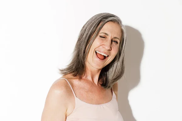 Mature Grey Woman Laughing Winking Camera Isolated White Wall — Stock Photo, Image