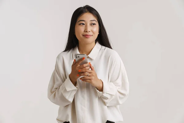 Young Asian Woman Smiling Using Mobile Phone Isolated White Wall — Stock Photo, Image