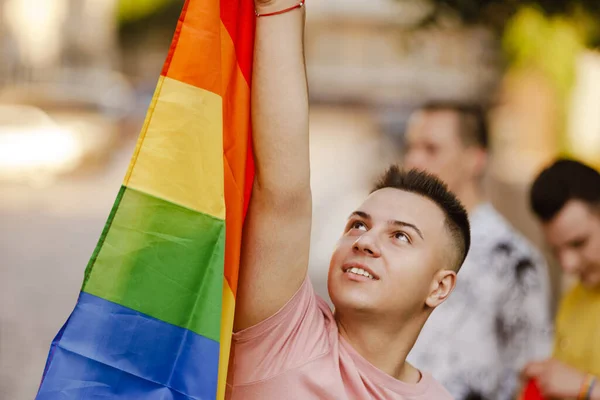 Close Smiling Young Man Holding Rainbow Flag Standing Group Smiling — Stock Photo, Image