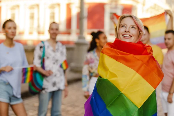 Young Lesbian Woman Wrapped Rainbow Flag Smiling Pride Parade City — Foto de Stock