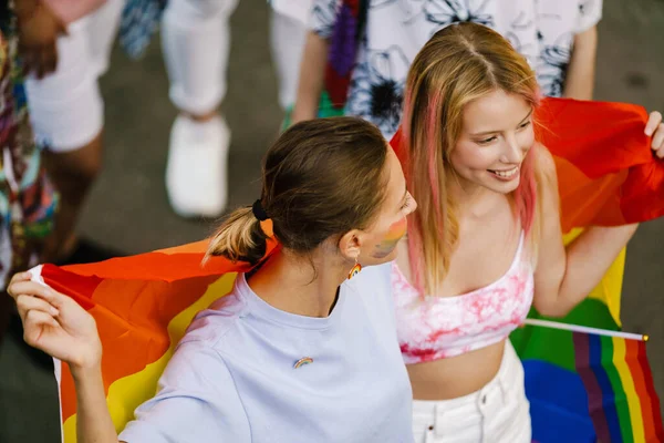 Young Lesbian Couple Smiling Walking Rainbow Flag Pride Parade City —  Fotos de Stock