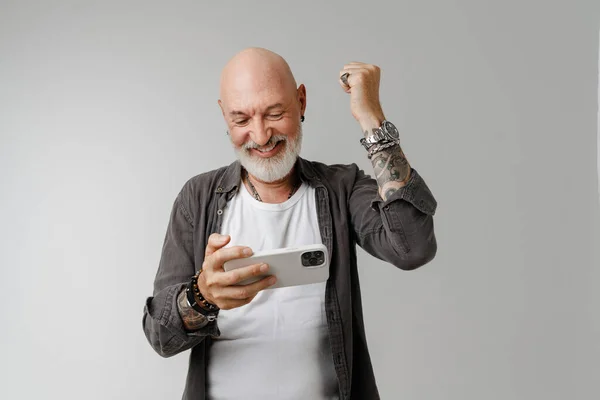 Bald European Man Playing Online Game Mobile Phone Isolated White — Zdjęcie stockowe