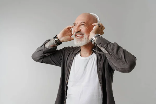Bald Bearded European Man Listening Music Headphones Isolated White Background — стоковое фото