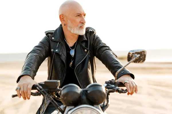 Bold Senior Man Wearing Leather Jacket Riding Motorcycle Outdoors Summer — стоковое фото