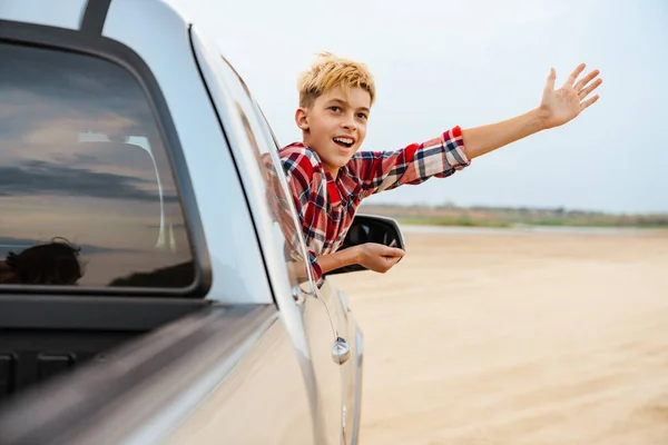 Teenage Boy Looking Out Car Window Driving Beach — ストック写真