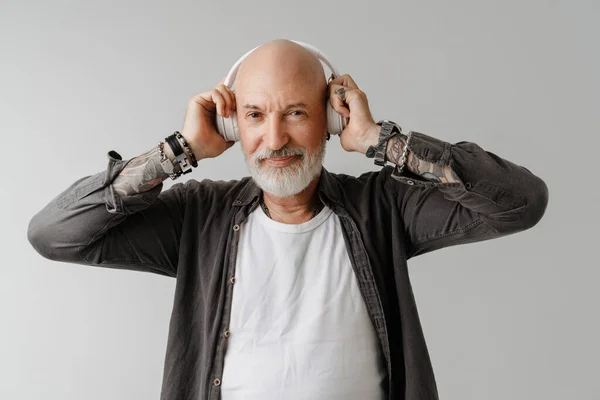 Bald Bearded European Man Listening Music Headphones Isolated White Background — Stockfoto