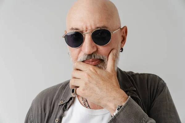 Bald European Man Sunglasses Holding His Chin Looking Camera Isolated — стоковое фото