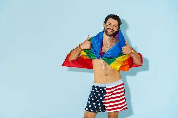 Shirtless Man Showing Thumbs While Posing Rainbow Flag Isolated Blue — Stock Photo, Image